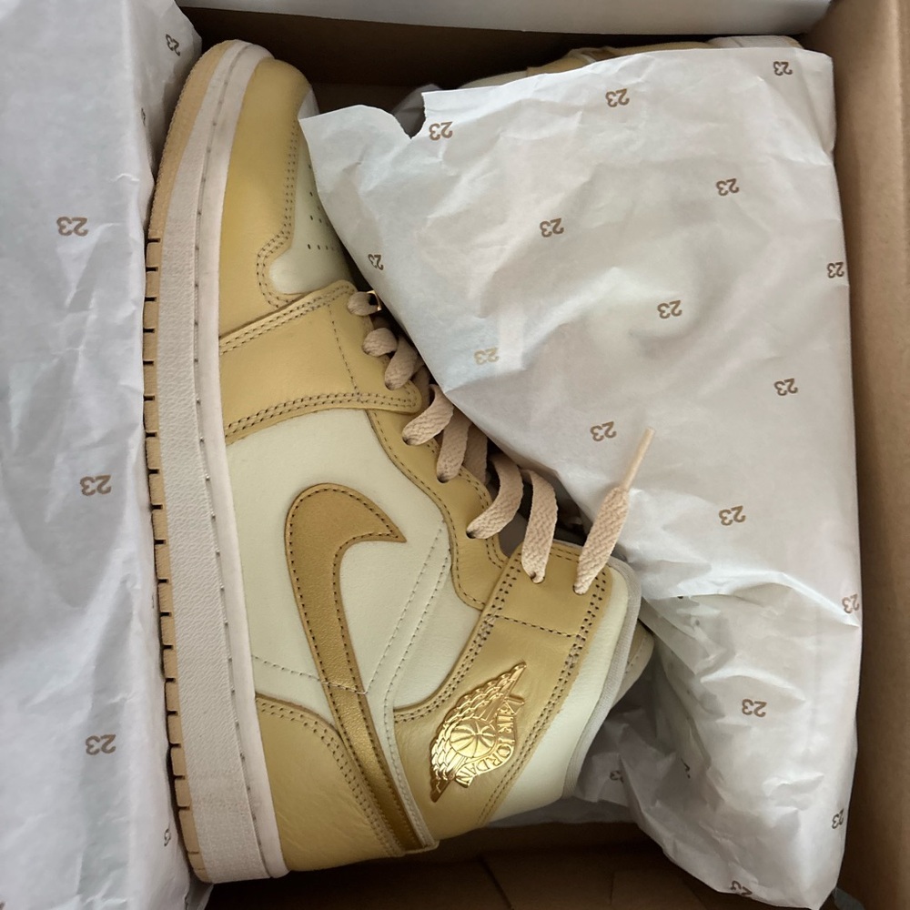 Nike Air Jordan 1 Mid Sneakers in Cream and Gold